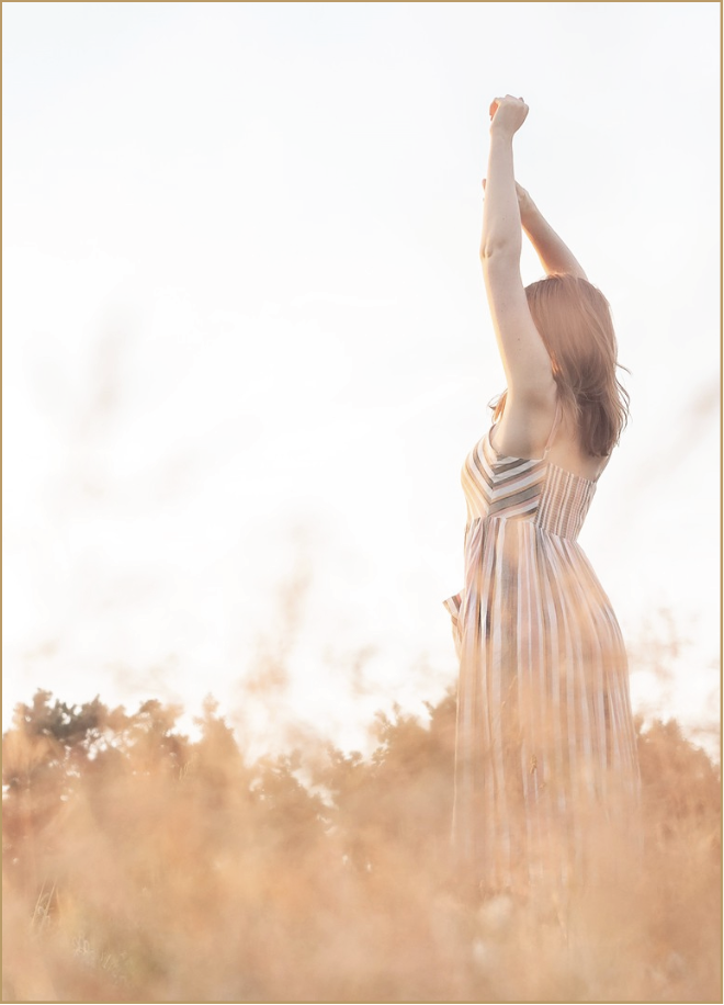 Woman stretching in golden field